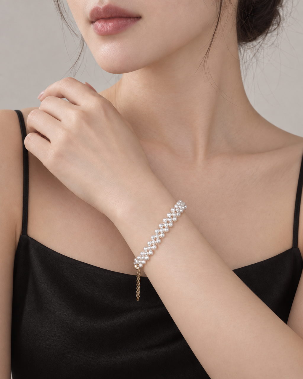 Handwoven rice pearl magnetic clasp bracelet worn on wrist